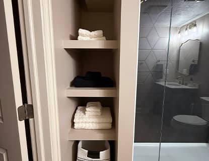 Basement bathroom with built-in storage and glass shower enclosure in Plain City, OH