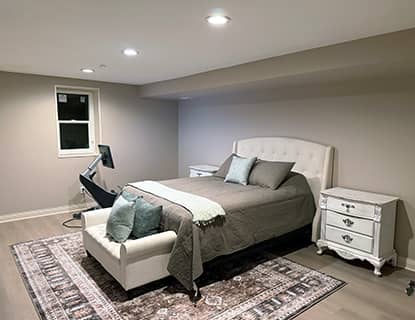 Basement bedroom area with recessed lighting in a Plain City, OH remodel
